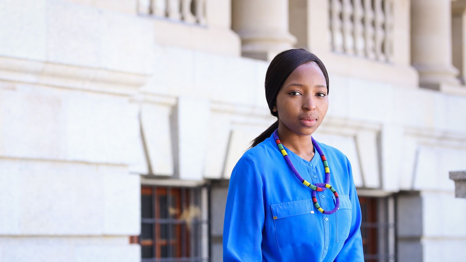 A Dell Young Leaders programme student poses outside a university building