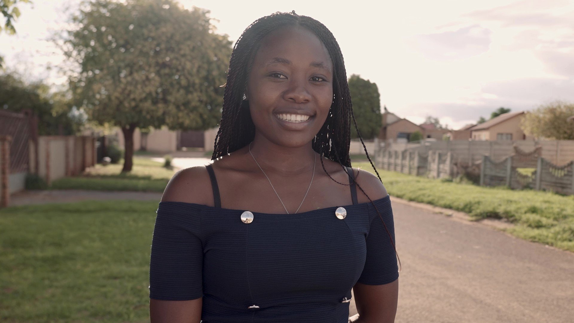 Dell Young Leaders alum Thandeka walks down a street in South Africa.